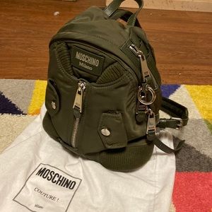 MOSCHINO
Military Green Nylon Bomber Jacket Backpack